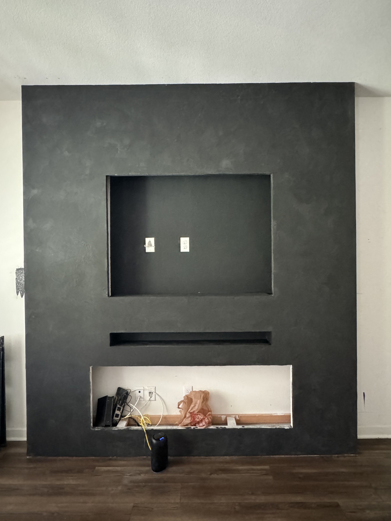 The finish — charcoal texture before equipment and shelving